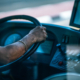 Side view of a bus driver during the day